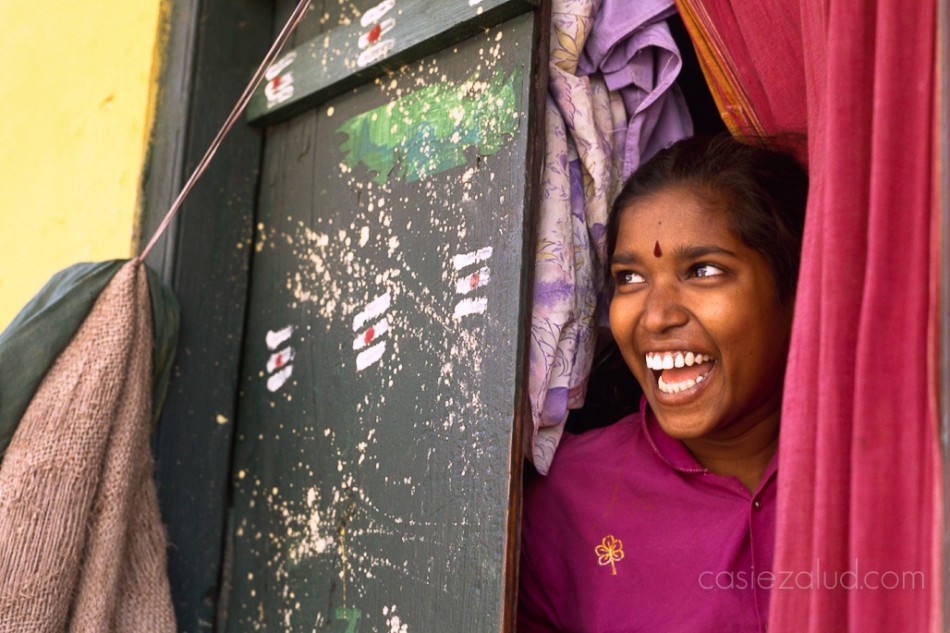 Indian woman with colorful door