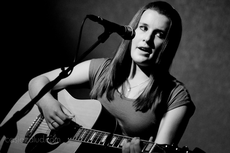 13-year old musiciam signing and playing guitar