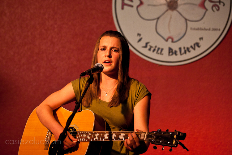 13-year old musician singing and playing guitar