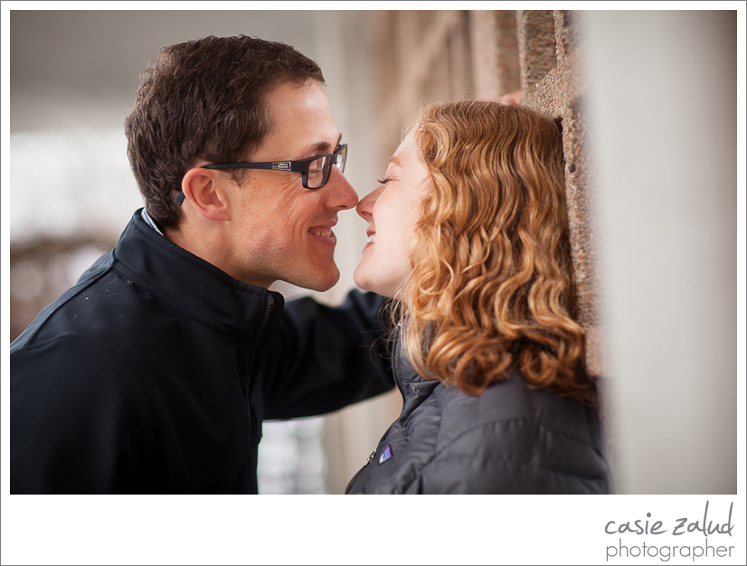 Boulder engaged couple close up flirting about to kiss