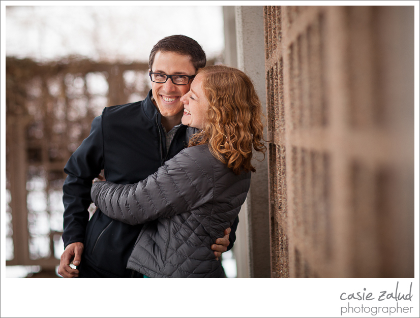 Engaged Boulder couple hugging in the outdoors