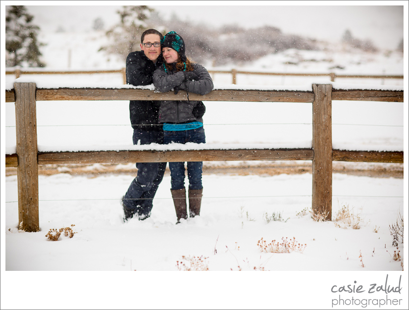 Engaged couple at Marshall Mesa trail in a snowstorm