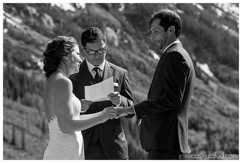 bride and groom leaving their intimate wedding ceremony at the amphitheater at the Maroon Bells 