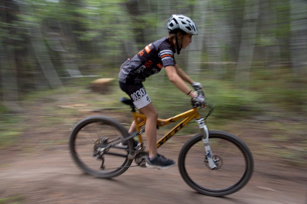teenager downhill mountain biking during colorado vacation